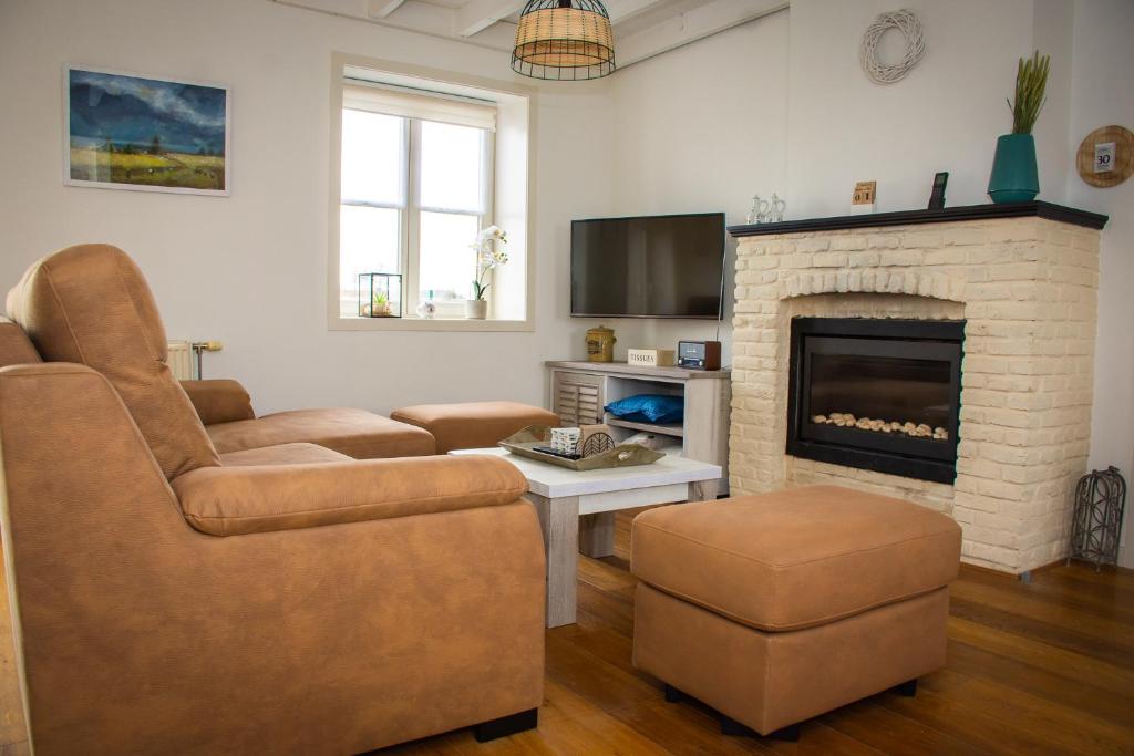Posezení v ubytování Huis van de Koekuit