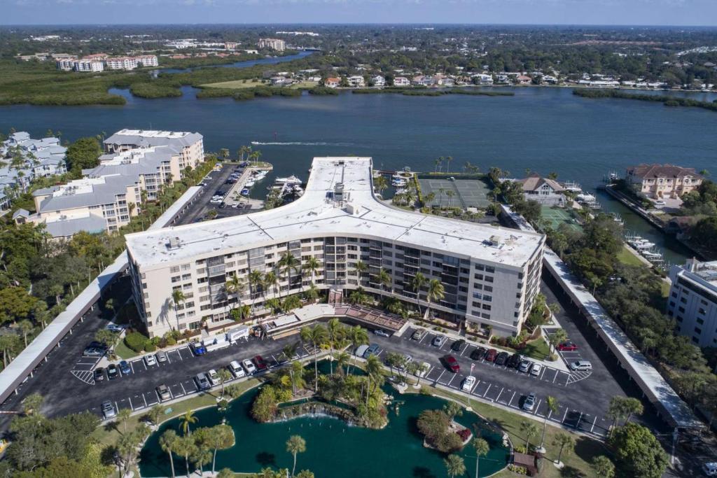 an aerial view of a building next to a body of water at Harbor Tower Intracoastal Condo in Siesta Key