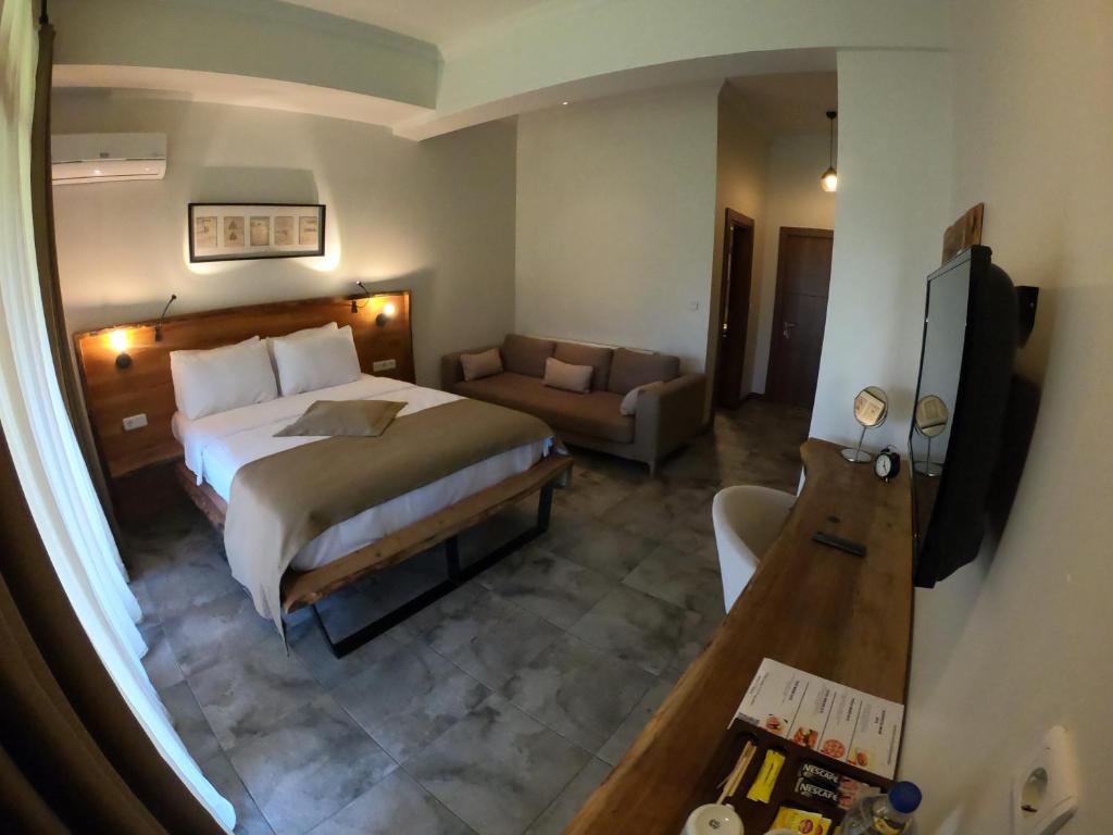 Postel nebo postele na pokoji v ubytování Cevizdibi Hotel