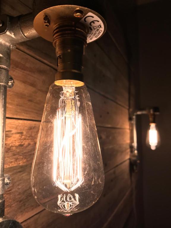 a light bulb is hanging from a pole at Kelston Guest House in Weymouth