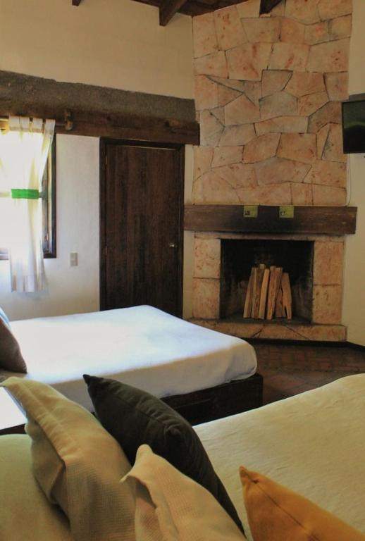 Postel nebo postele na pokoji v ubytování Spa Holistico Real Hotel