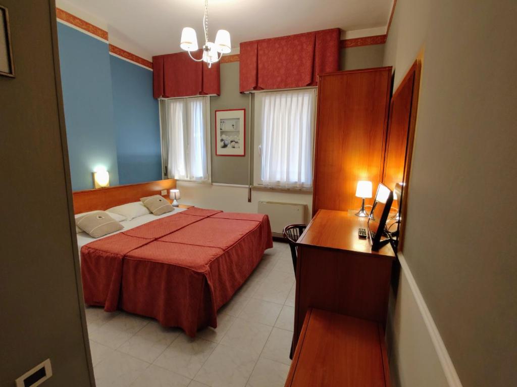 Кровать или кровати в номере Hotel Minerva