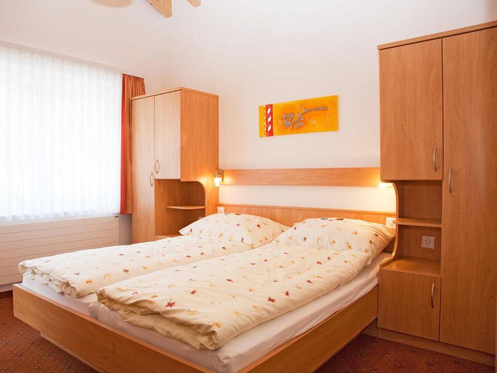 Postel nebo postele na pokoji v ubytování Hotel Monte-Moro