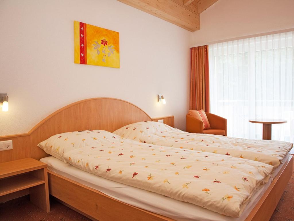 Postel nebo postele na pokoji v ubytování Hotel Monte-Moro