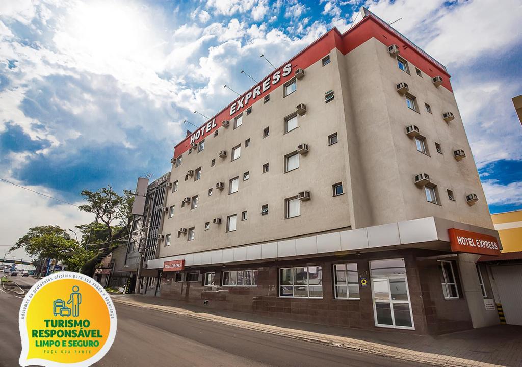 a large building on the side of a street at Hotel Express Canoas in Canoas