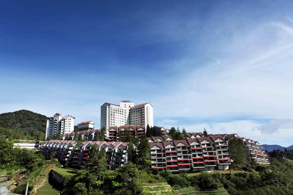 a group of buildings on a hill with trees at Copthorne Cameron Highlands in Cameron Highlands