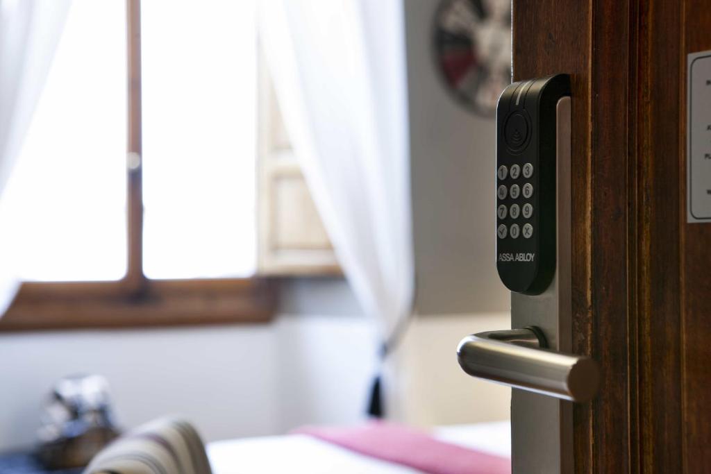A bed or beds in a room at B&B Prestigia Rooms