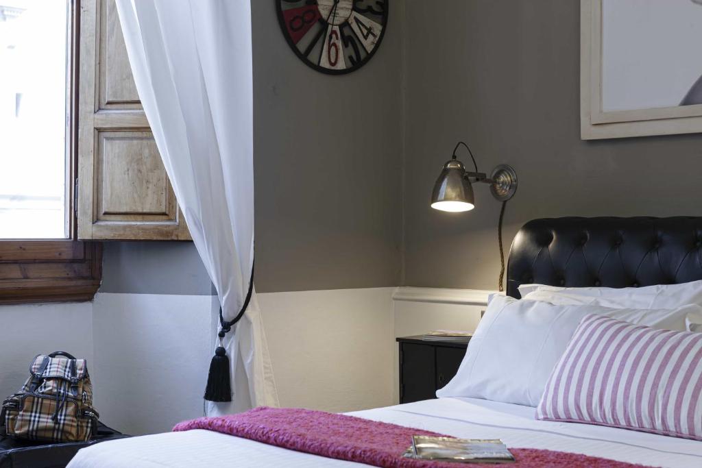 A bed or beds in a room at B&B Prestigia Rooms