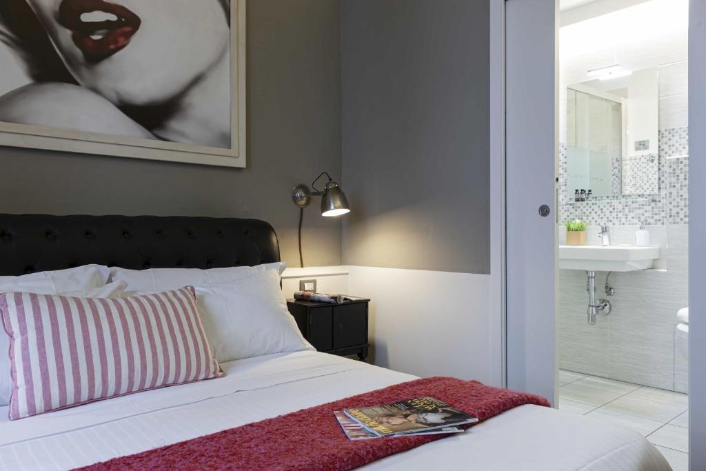A bed or beds in a room at B&B Prestigia Rooms