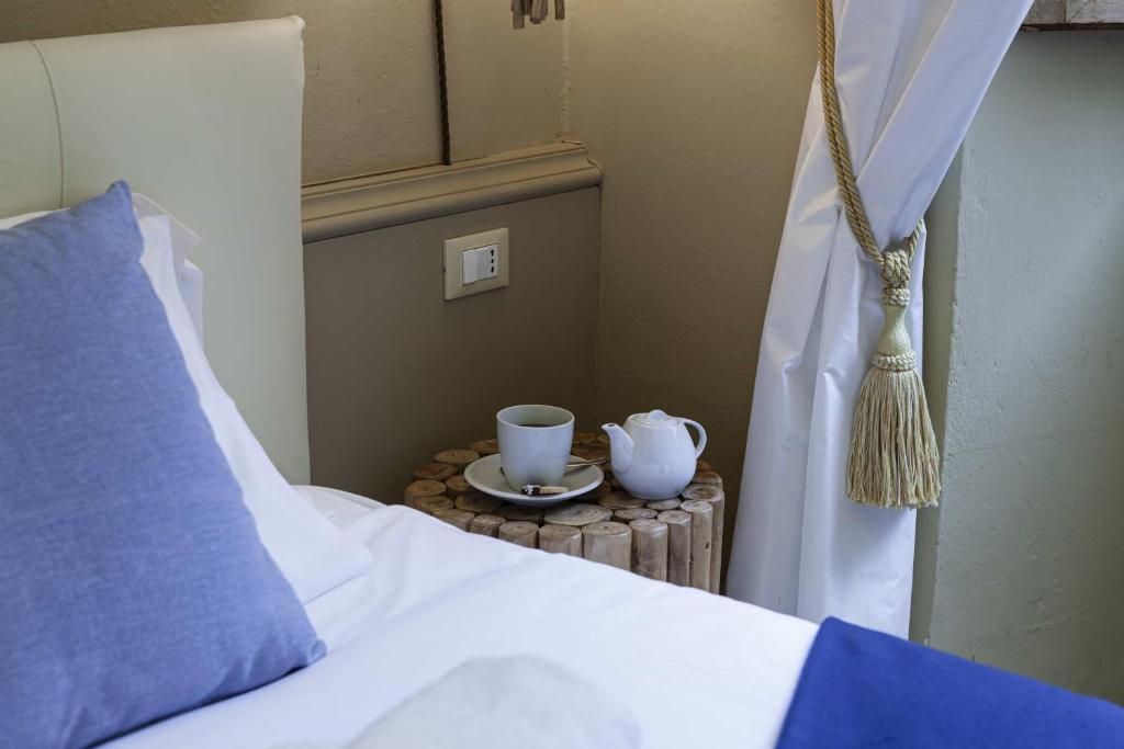 A bed or beds in a room at B&B Prestigia Rooms