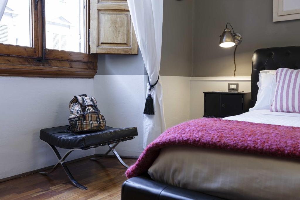 A bed or beds in a room at B&B Prestigia Rooms