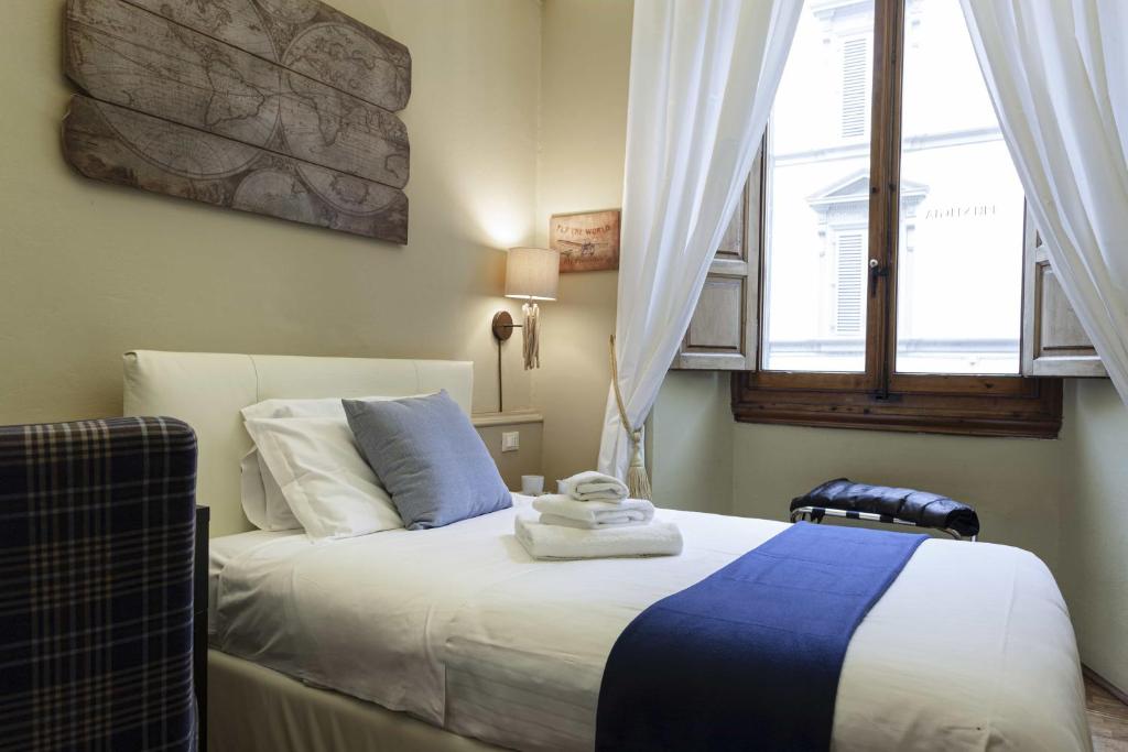 A bed or beds in a room at B&B Prestigia Rooms