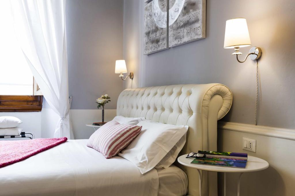 A bed or beds in a room at B&B Prestigia Rooms