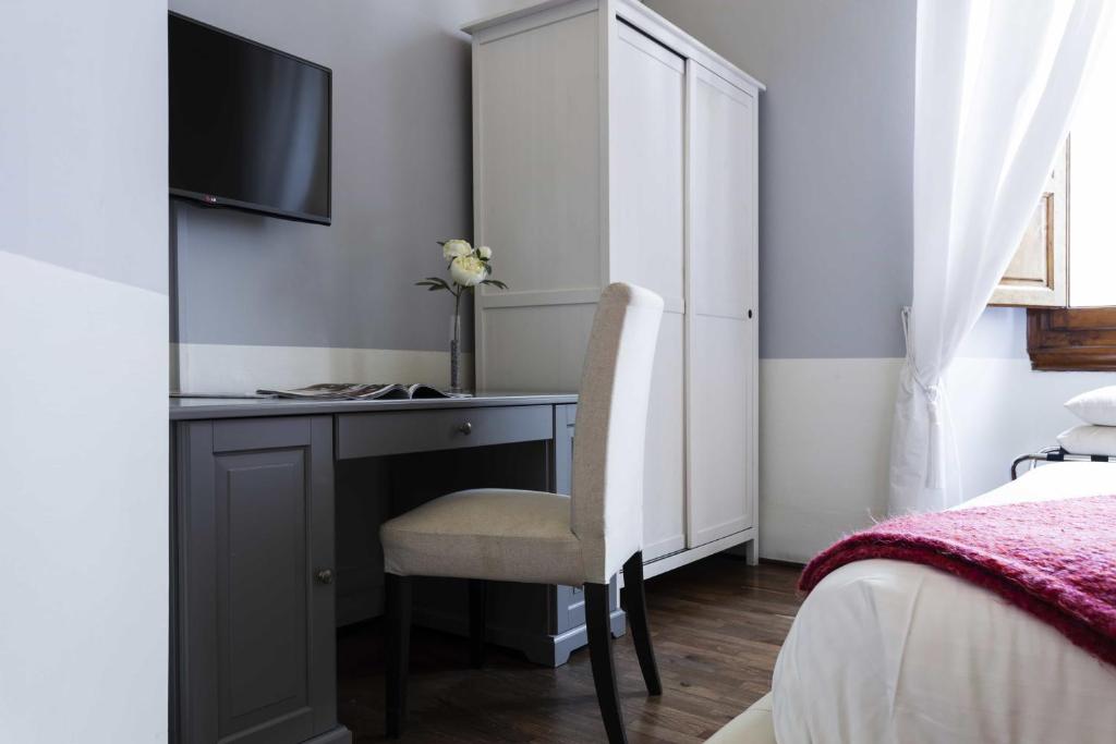 A bed or beds in a room at B&B Prestigia Rooms