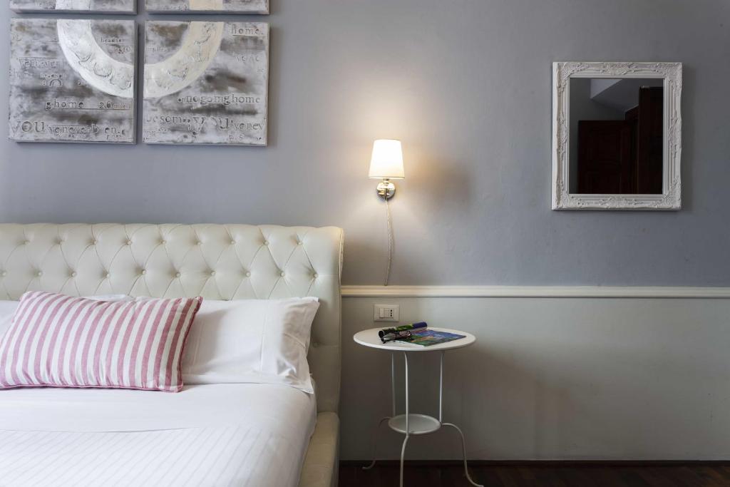 A bed or beds in a room at B&B Prestigia Rooms