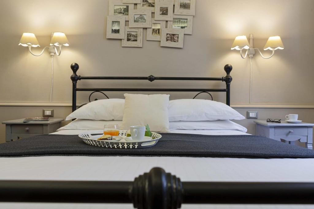 A bed or beds in a room at B&B Prestigia Rooms