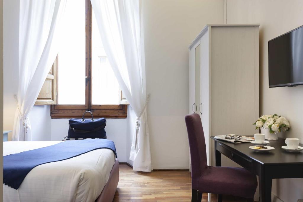 A television and/or entertainment centre at B&B Prestigia Rooms