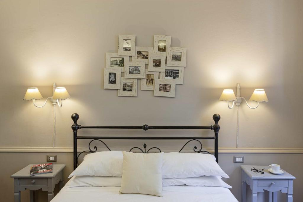 A bed or beds in a room at B&B Prestigia Rooms