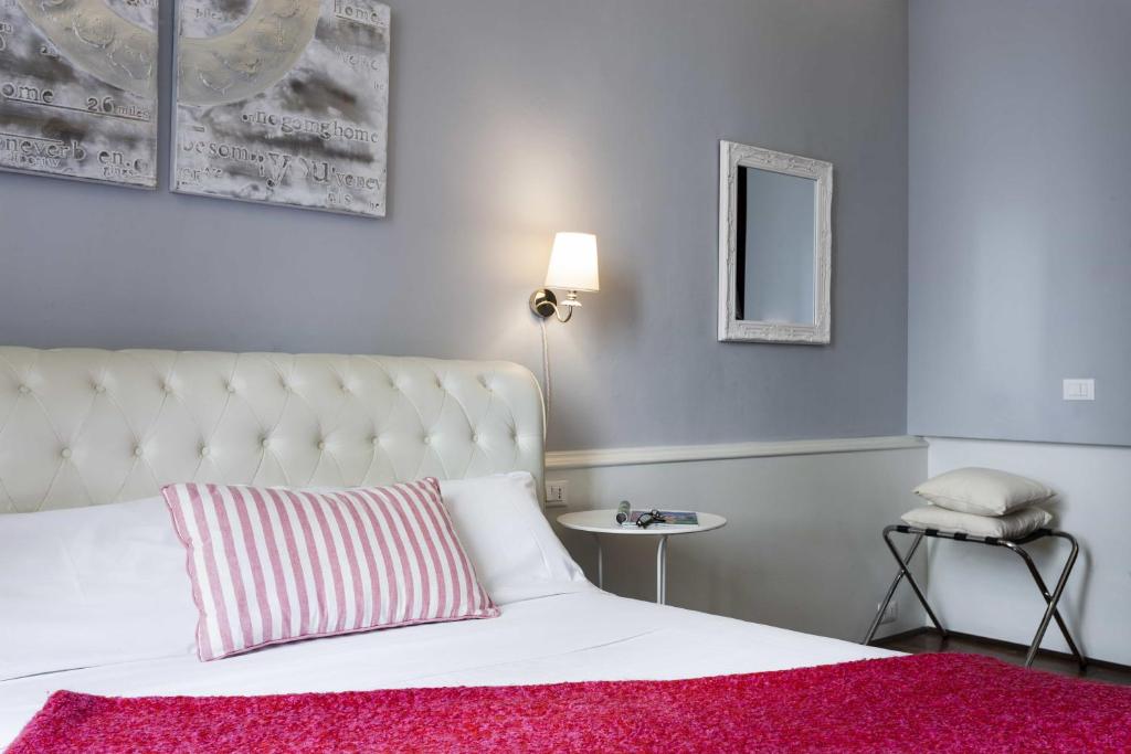 A bed or beds in a room at B&B Prestigia Rooms