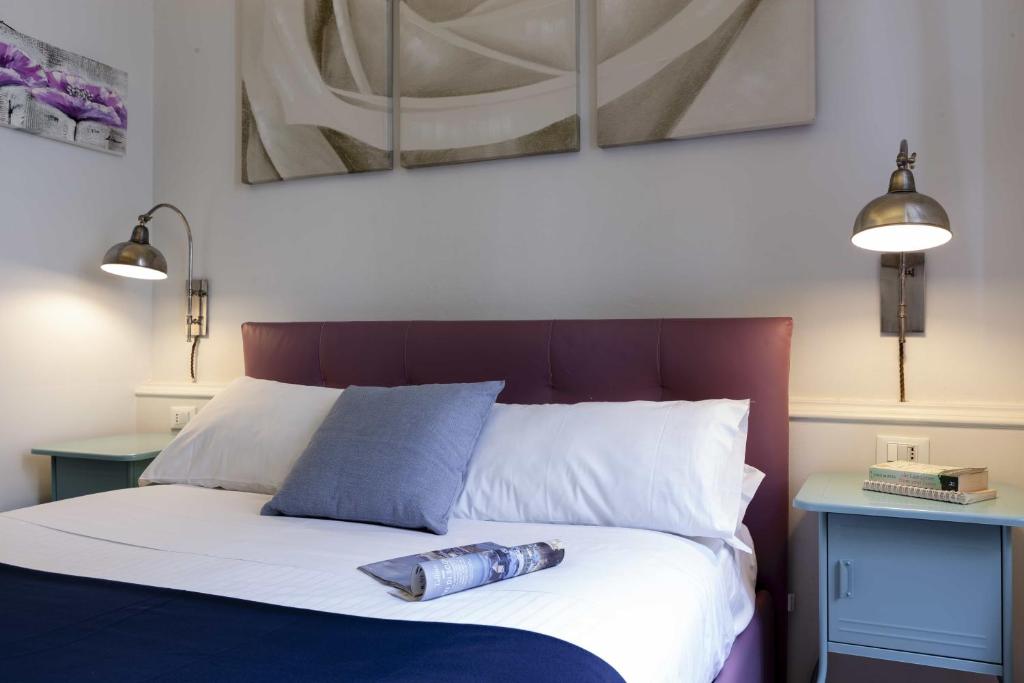A bed or beds in a room at B&B Prestigia Rooms