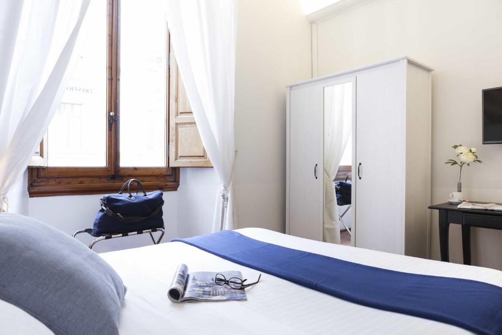 A bed or beds in a room at B&B Prestigia Rooms