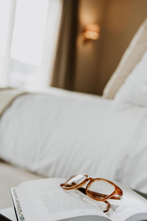 Postel nebo postele na pokoji v ubytování Grand Hotel Belle Vue