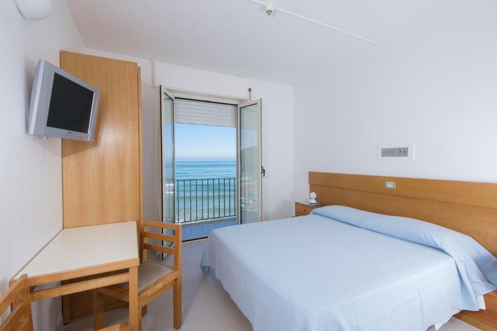 Postel nebo postele na pokoji v ubytování Albergo La Sirenella