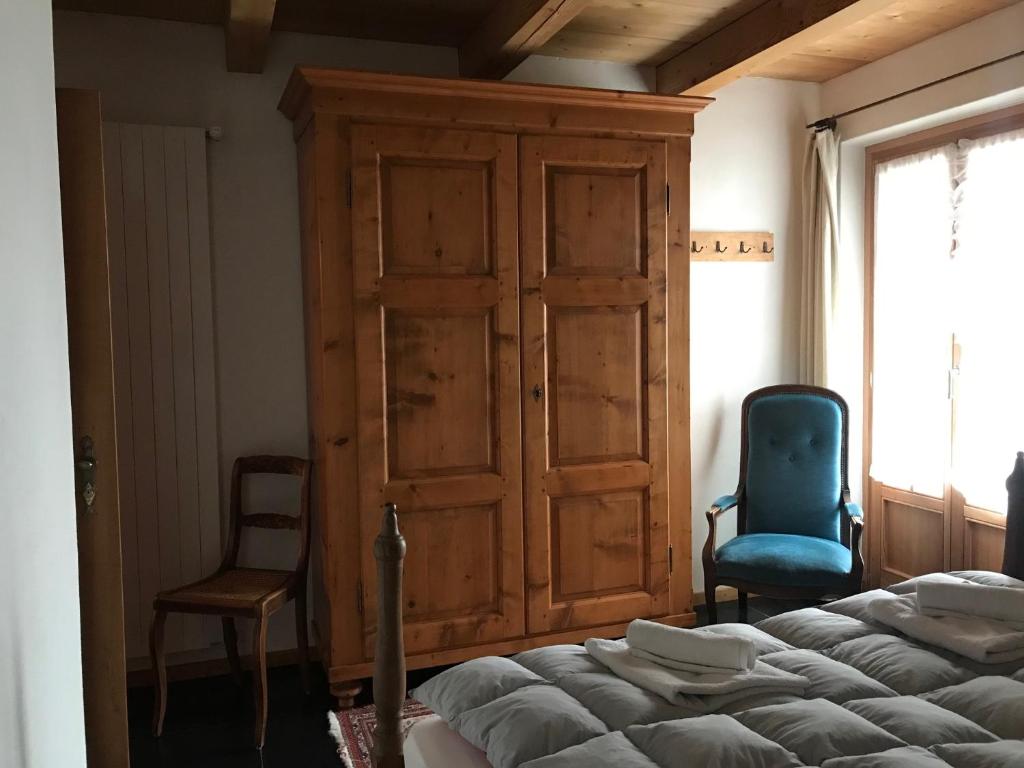 Postel nebo postele na pokoji v ubytování Chalet Charm