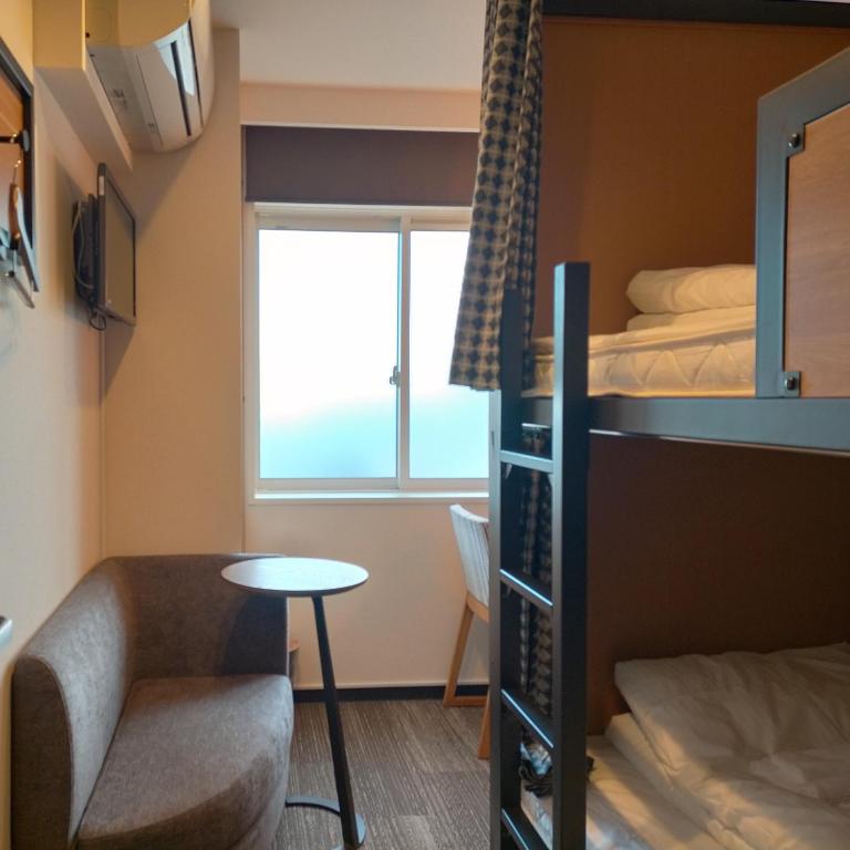 Postel nebo postele na pokoji v ubytování Hatago COEDOYA