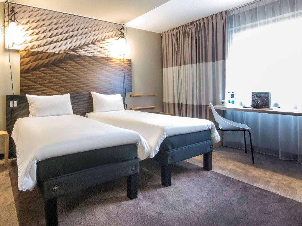 Postel nebo postele na pokoji v ubytování Ibis Poznan Centrum