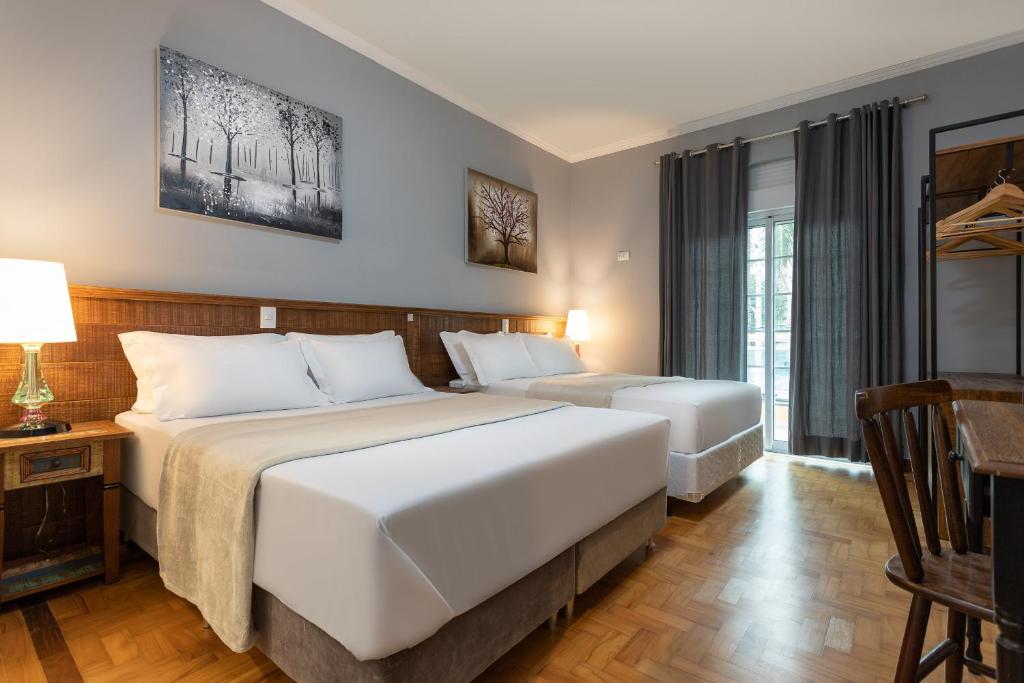 Postel nebo postele na pokoji v ubytování Hotel Pousada Pacaembu