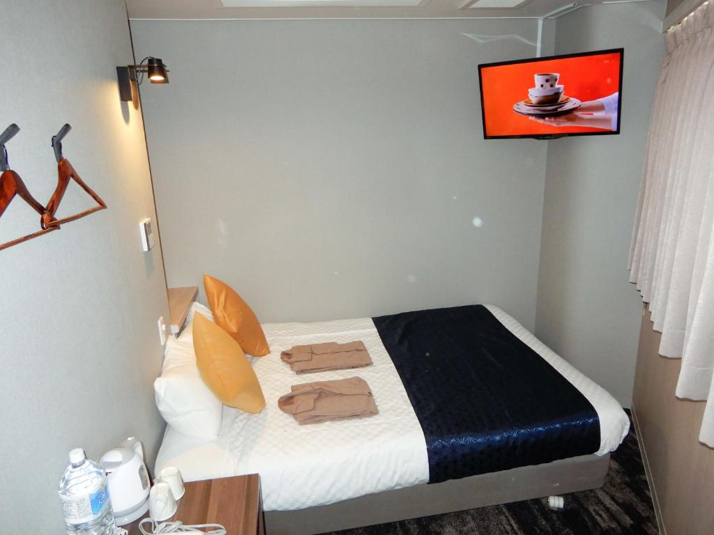 Postel nebo postele na pokoji v ubytování Hotel S-Presso North