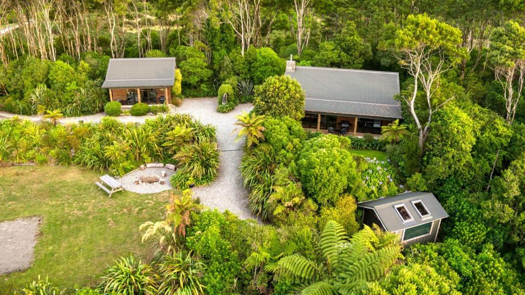 an aerial view of a house in the forest at Paparoa Beach Hideaway with Hot Tub in Barrytown