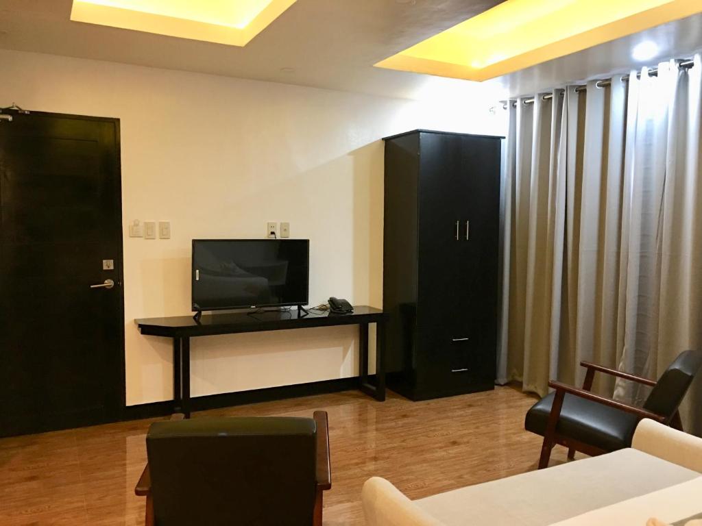 TV a/nebo společenská místnost v ubytování Rangya Hotel