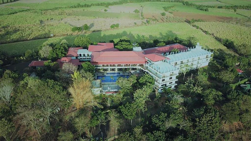 a large building with a bunch of trees on top of it at Centauria Wild in Udawalawe