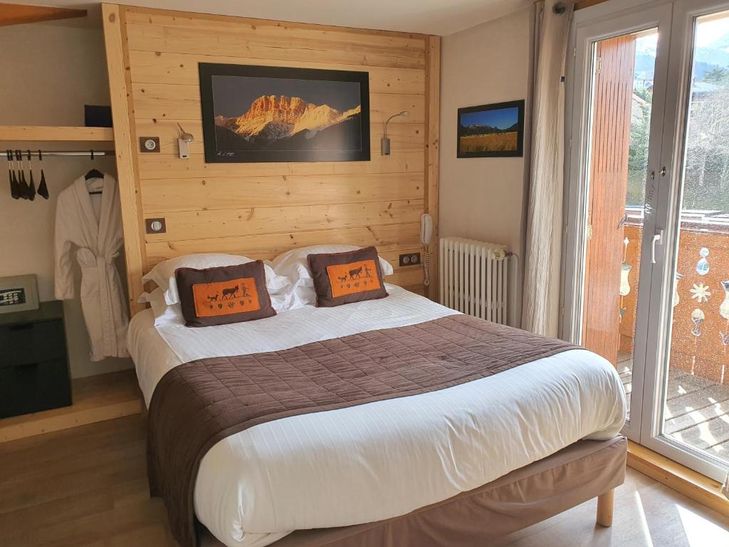 Postel nebo postele na pokoji v ubytování Joy Villard de Lans