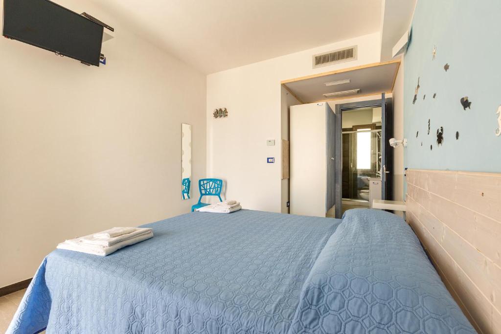Postel nebo postele na pokoji v ubytování Maresidence - il Residence sul mare a Torre Pali