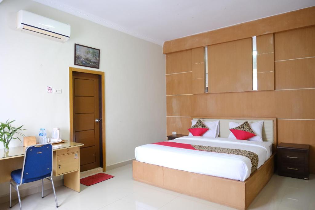 Postel nebo postele na pokoji v ubytování Joyful Hotel