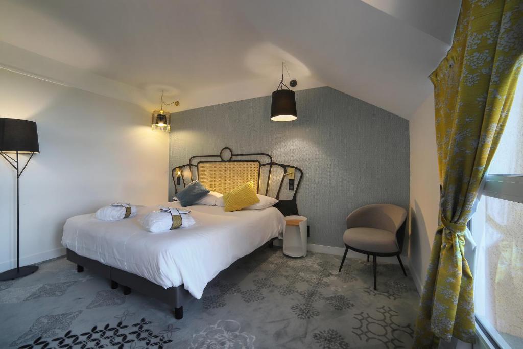 Postel nebo postele na pokoji v ubytování Mercure Orléans Portes de Sologne