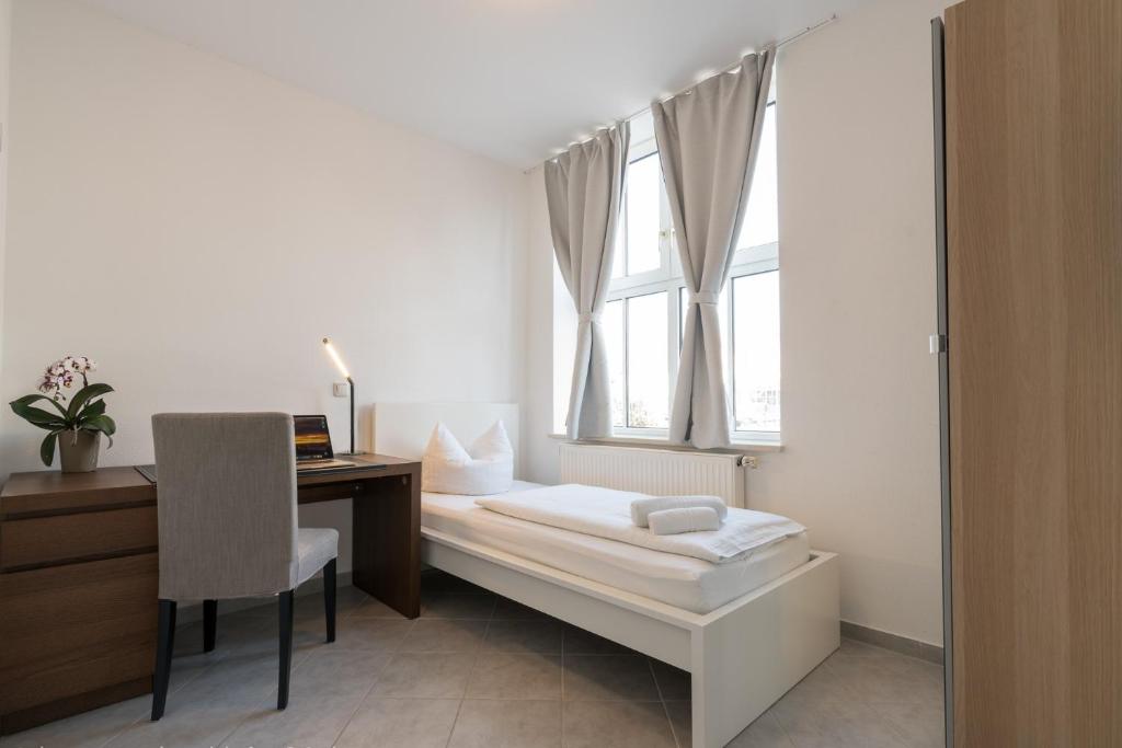 Postel nebo postele na pokoji v ubytování guenstigschlafen24 – die günstige Alternative zum Hotel