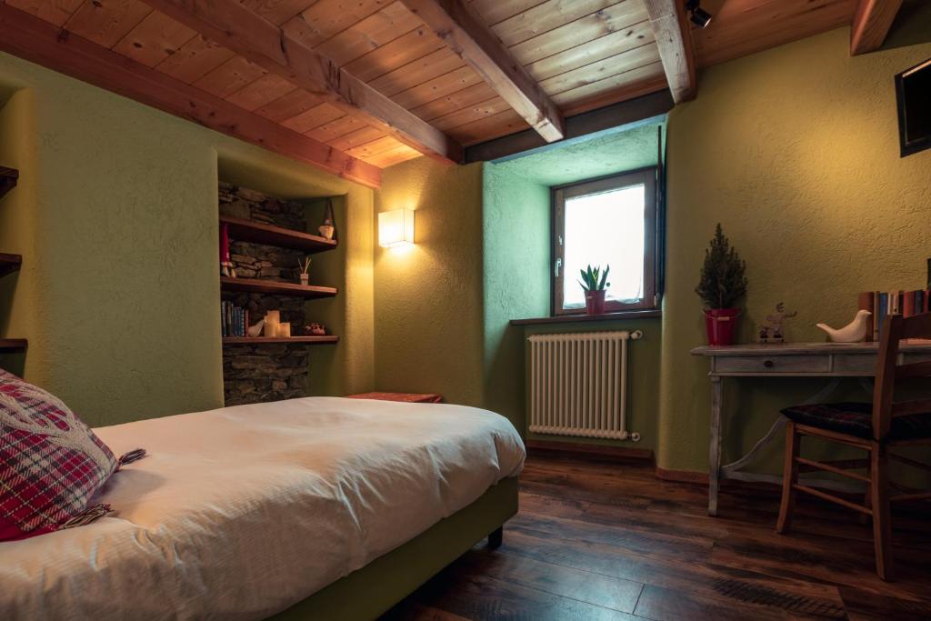 Llit o llits en una habitació de Rifugio Lilla