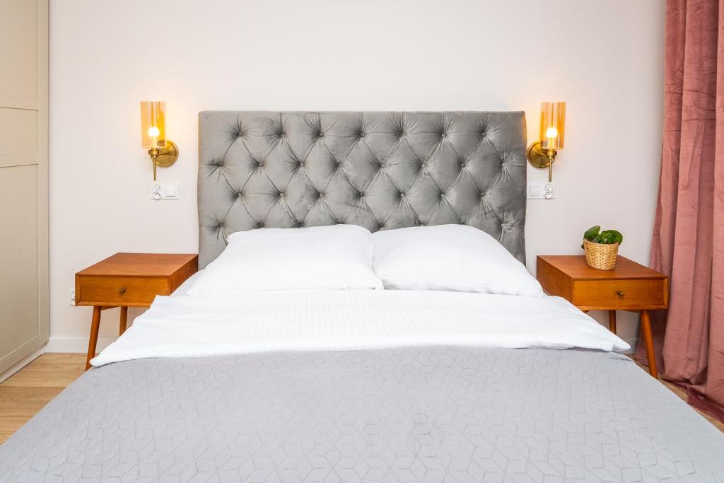 Posteľ alebo postele v izbe v ubytovaní PoBookowane River View Apartments Gdańsk