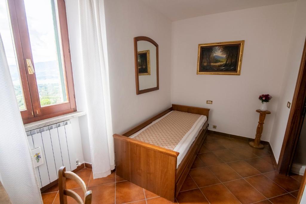 Łóżko lub łóżka w pokoju w obiekcie CASA VIA DEL PERO