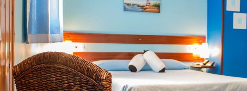 Postel nebo postele na pokoji v ubytování Hotel A. G. Porcillan