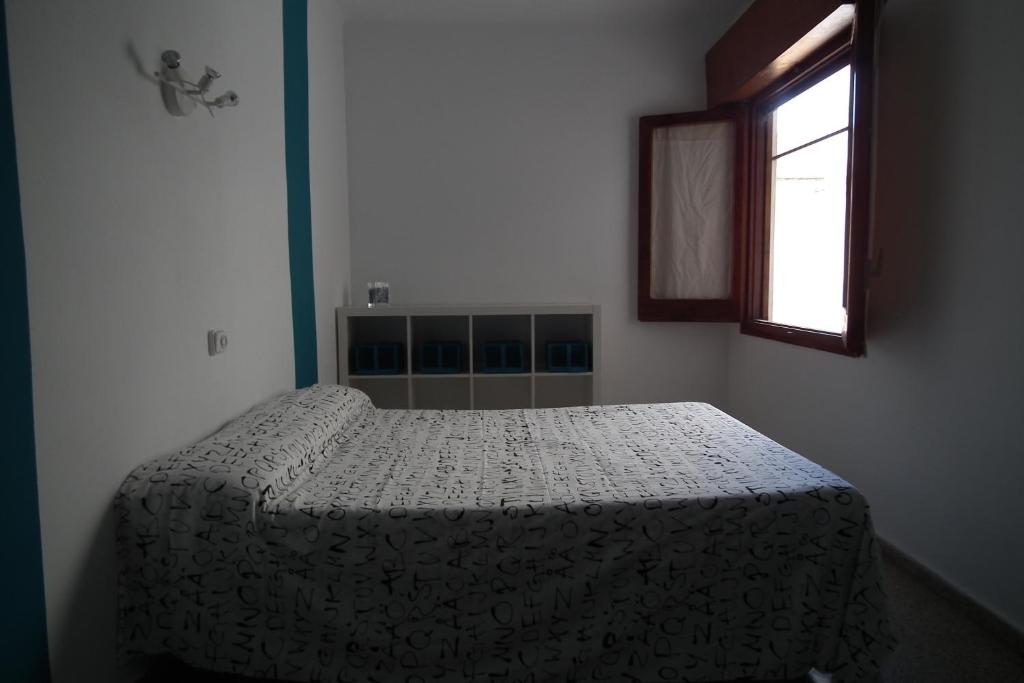 Posteľ alebo postele v izbe v ubytovaní Hostal San Carlos