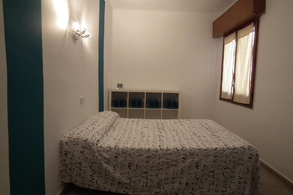 Posteľ alebo postele v izbe v ubytovaní Hostal San Carlos