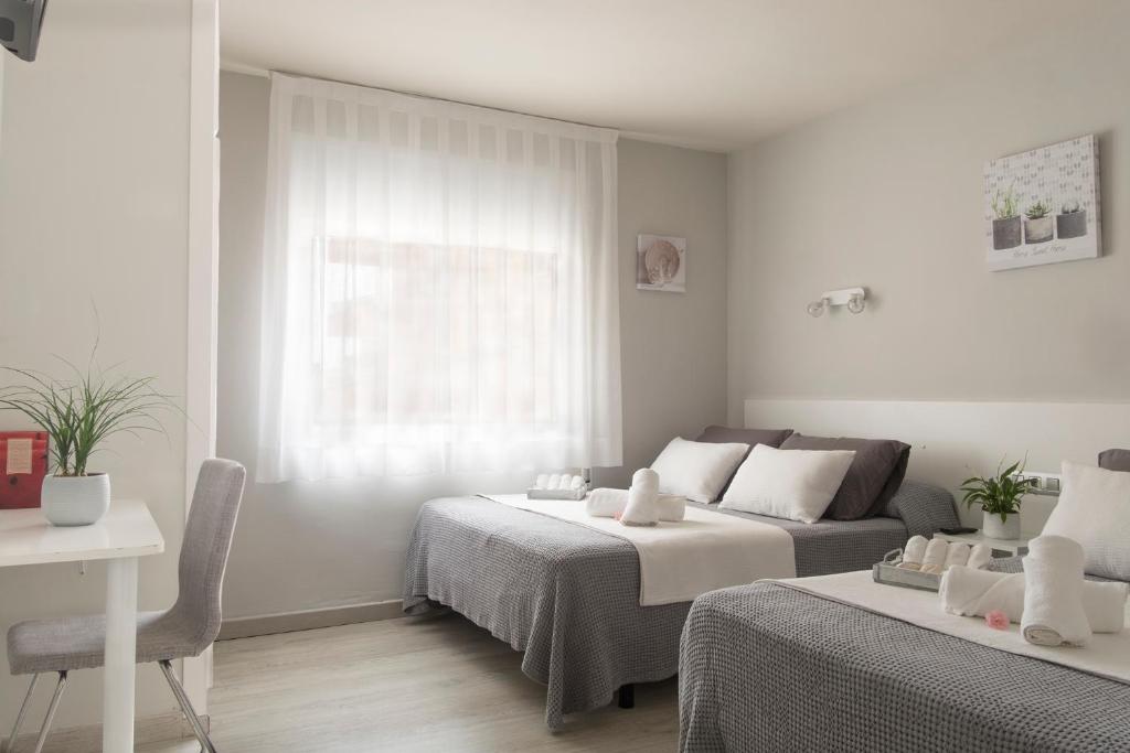 Cama o camas de una habitación en Hotel Tolosa