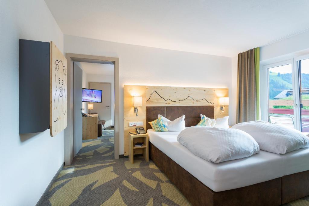 Posteľ alebo postele v izbe v ubytovaní Familotel Kaiserhof - Families only