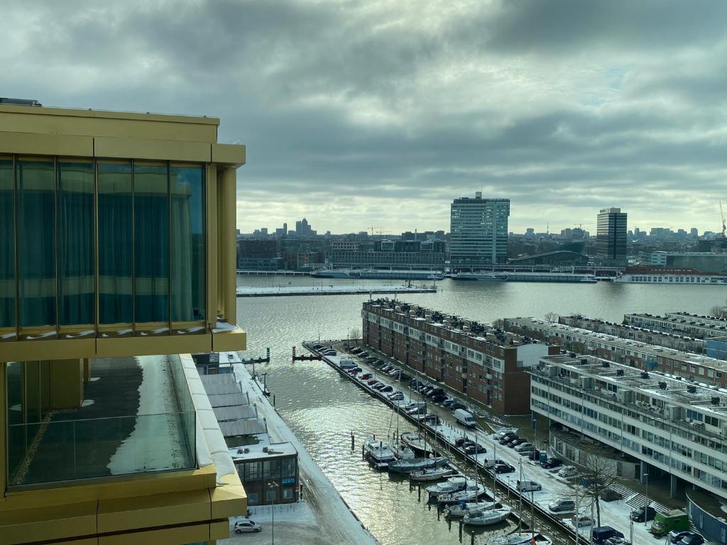 a view of a harbor with boats in the water at Holiday Inn Express Amsterdam - North Riverside by IHG in Amsterdam