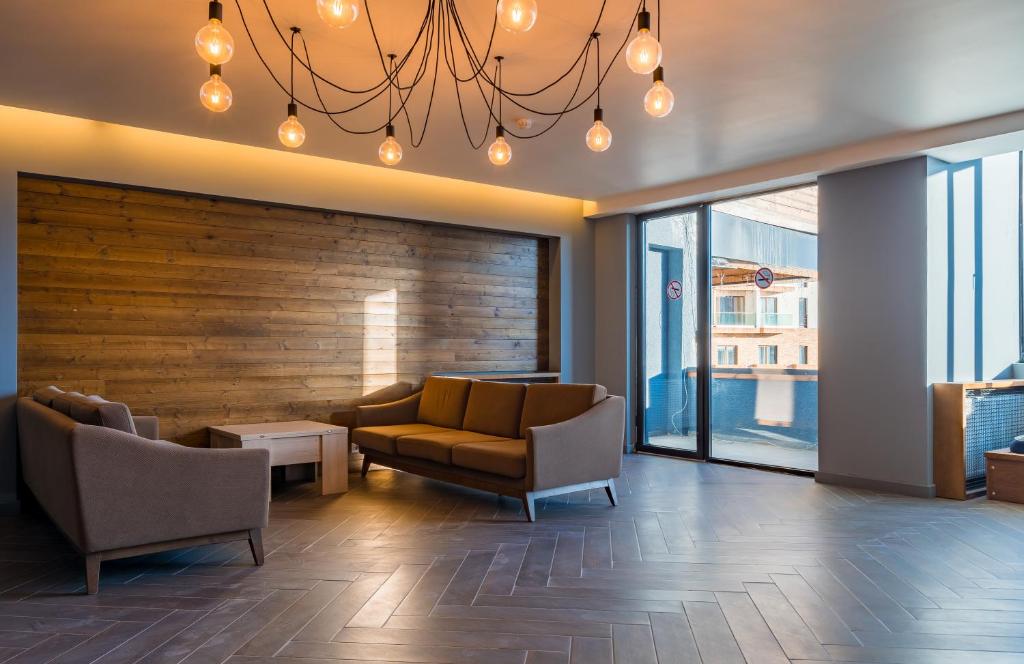 Posezení v ubytování GVC 2-level apt New Gudauri